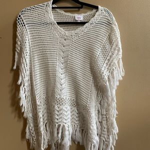 A white crochet cardigan without sleeves